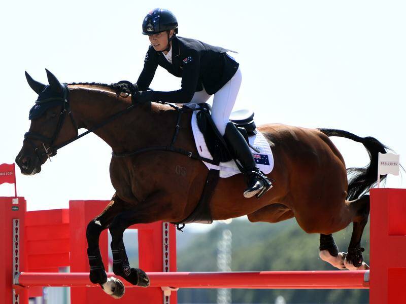 Late replacement Shenae Lowings in action during the team showjumping at Versailles. Photo: Joel Carrett/AAP PHOTOS