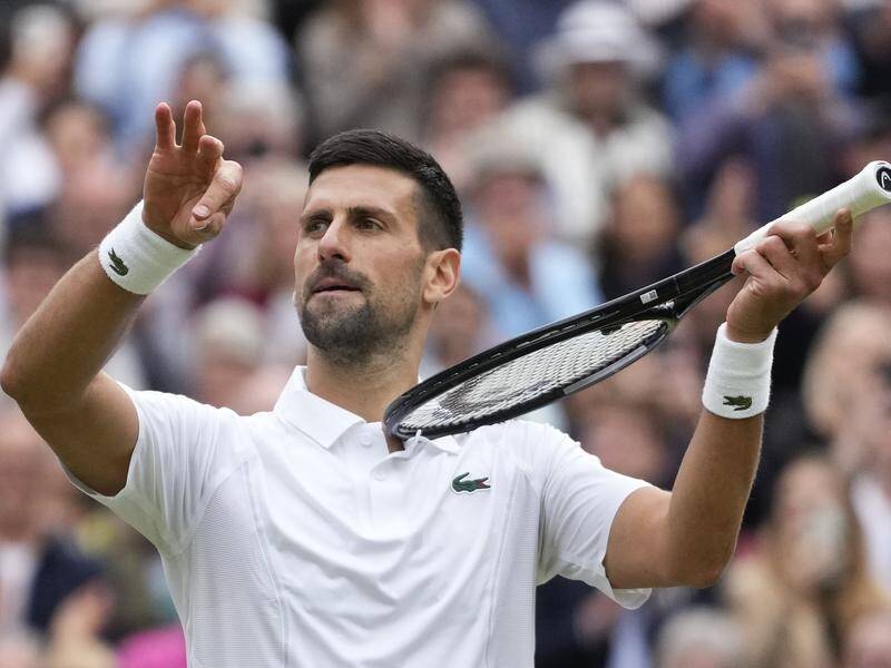 Novak Djokovic on his imaginary violin after showing no Wimbledon mercy to Lorenzo Musetti. (AP PHOTO)