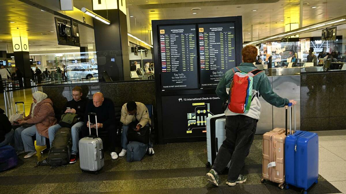 Flights were still being delayed on Saturday after Friday's cancellations. (James Ross/AAP PHOTOS)