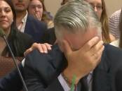Actor Alec Baldwin weeps with relief after a judge threw out the manslaughter case against him. (AP PHOTO)