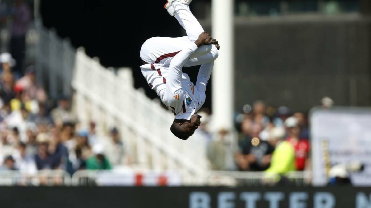 West Indies' Kevin Sinclair celebrates the wicket of England's Harry Brook with a somersault. (AP PHOTO)