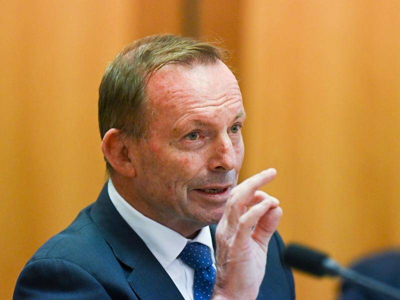 Former prime minister Tony Abbott says 'woke' organisations will try to buy the referendum result. (Lukas Coch/AAP PHOTOS)