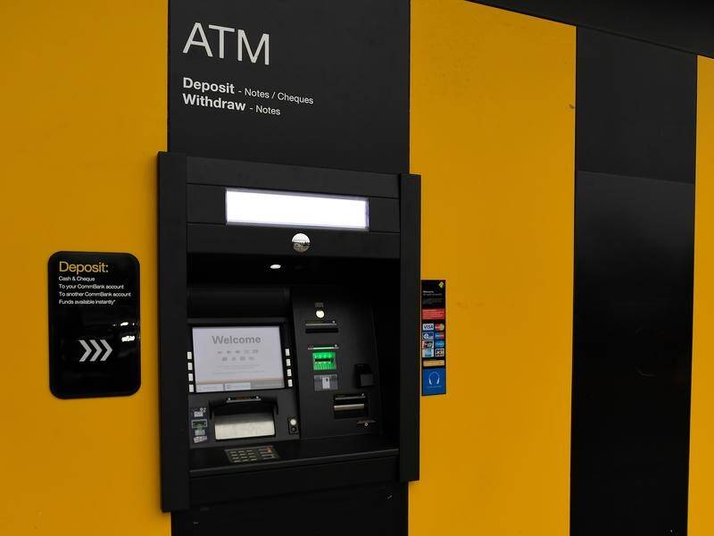The number of ATMs and bank branches where people can get money out is declining. (Albert Perez/AAP PHOTOS)