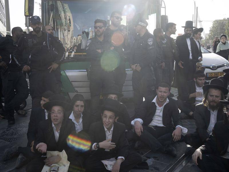 Ultra-Orthodox men against an Israeli army draft say they will not "join the army of destruction". (AP PHOTO)