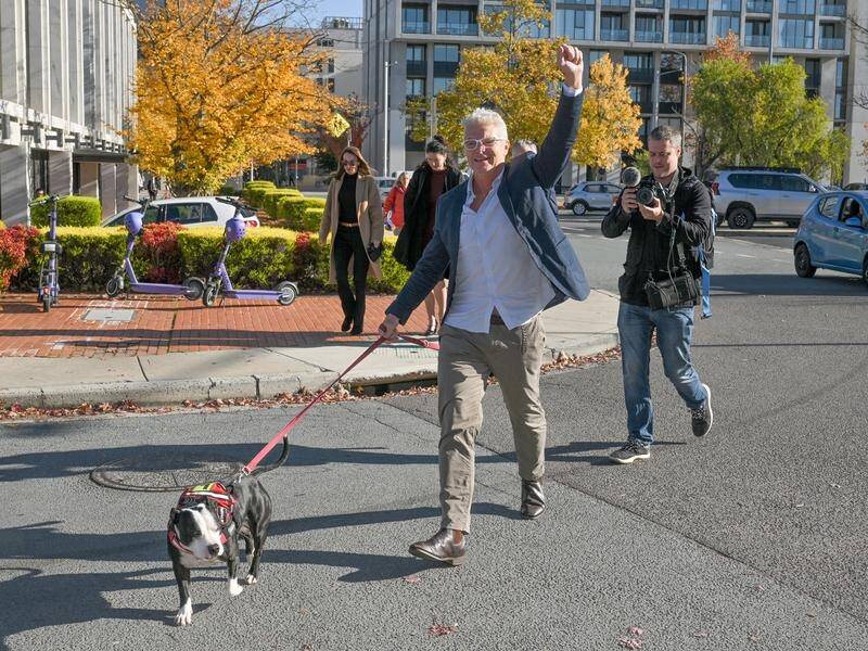 War crimes whistleblower David McBride arrived at court for sentencing with his dog. (Mick Tsikas/AAP PHOTOS)