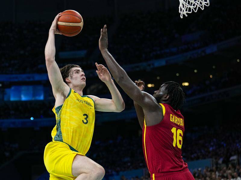 Josh Giddey was among the stars as Australia opened the Olympic basketball tournament in style. Photo: AP PHOTO