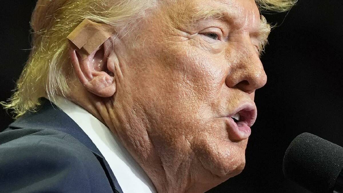 Trump was wearing a skin-coloured bandage on his ear in place of the white gauze from the past week. (AP PHOTO)