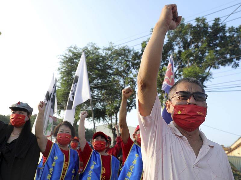 The Taiwan People's Communist Party have gathered to mark China's national day in Tainan. (AP PHOTO)