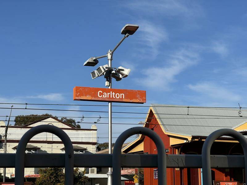 A pram carrying twins rolled from a Carlton platform onto tracks, killing a toddler and her dad. Photo: Mick Tsikas/AAP PHOTOS