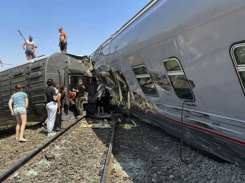 A least eight carriages were derailed during a collision with a truck at a crossing in Russia. Photo: AP PHOTO