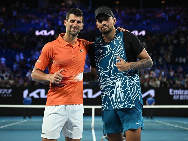 Nick Kyrgios (r) at the Australian Open warm-up with Novak Djokovic that confirmed he needed an op. (James Ross/AAP PHOTOS)