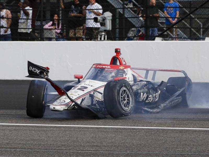 Will Power's damaged car slides after crashing into the wall during the Indianapolis 500. (AP PHOTO)