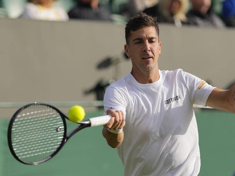 Thanasi Kokkinakis has limped out of Wimbledon with a worrying injury to his left knee. (AP PHOTO)