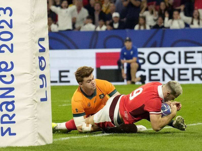 Gareth Davies scores Wales' opening try in their World Cup humiliation of the Wallabies in Lyon. (AP PHOTO)