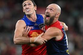 Oscar McInerney's (L) ruck battle with Max Gawn (R) will be a highlight in the Lions-Demons clash. (James Ross/AAP PHOTOS)