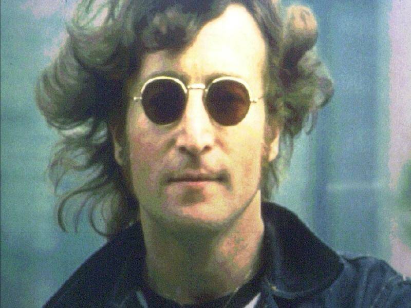 John Lennon-style glasses given to a fan in 1968 are expected to fetch up to $A5797 at auction. Photo: AP PHOTO