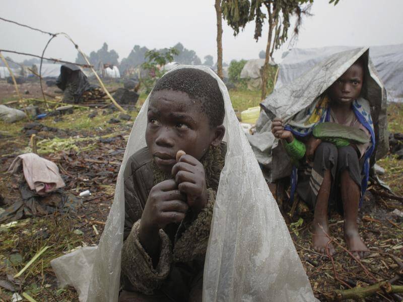 Heavy rains in Congo resulted in a massive landslide in which 12 died and at least 50 are missing. (AP PHOTO)