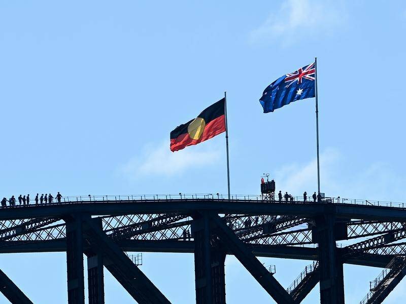 The Aboriginal flag will permanently replace the NSW flag on top of the Sydney Harbour Bridge.