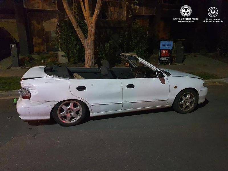 Adelaide police discovered the 'convertible' was just a normal sedan with the roof hacked off.