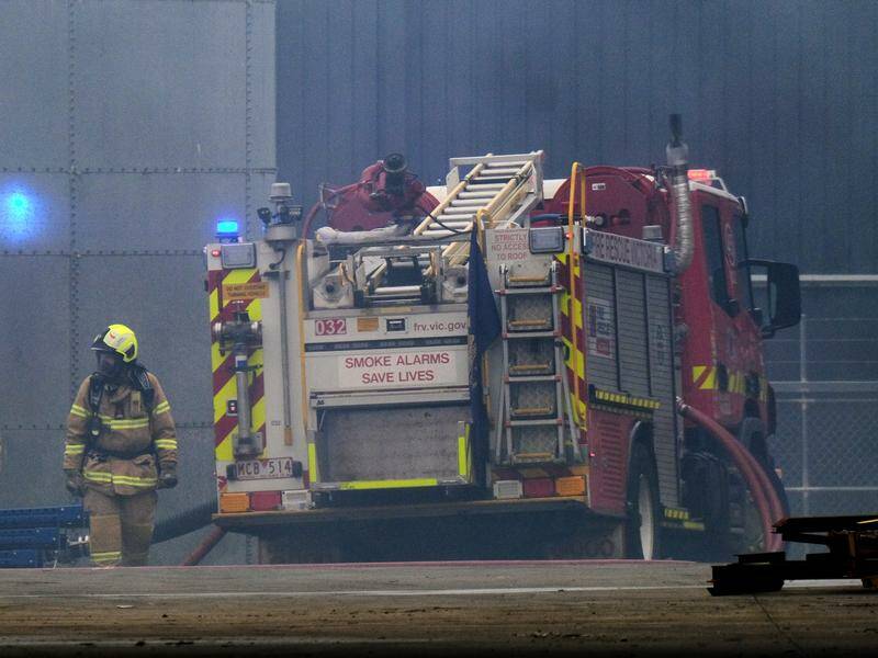 Two men accused of arson causing two deaths in a factory fire have applied for bail. Photo: Luis Ascui/AAP PHOTOS