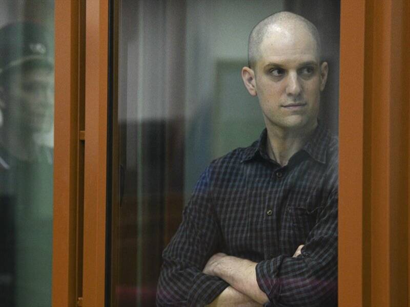 Evan Gershkovich appeared in a glass box with his head shaved during his court appearance. (AP PHOTO)