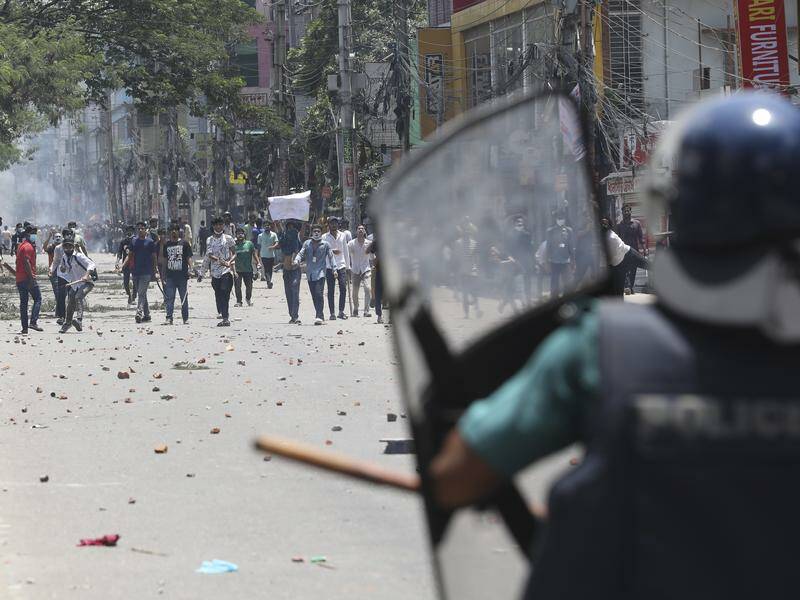 For five days Bangladesh police have fired tear gas and hurled sound grenades to scatter protesters. Photo: AP PHOTO