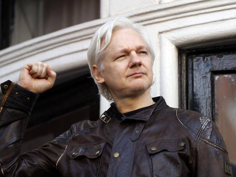 Julian Assange remains in jail in the UK and is wanted in the US on 18 charges. (AP PHOTO)