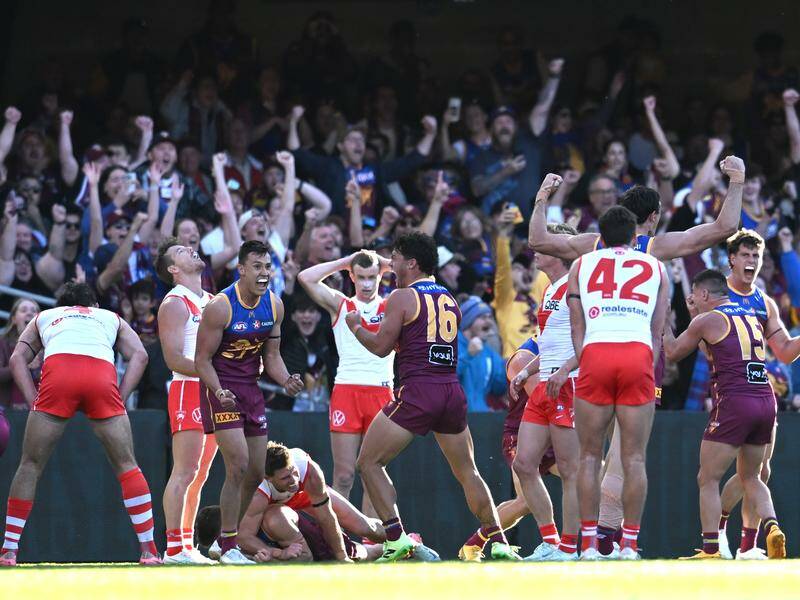 Brisbane have beaten Sydney by two points in a top-of-the-ladder classic at the Gabba. Photo: Darren England/AAP PHOTOS