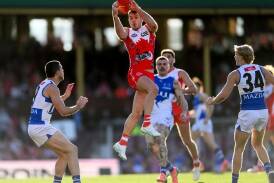 Luke Parker flies high against North to mark in his Swans return after injury and suspension. (Steven Markham/AAP PHOTOS)