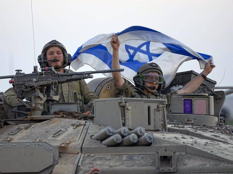 Israeli tanks are heading toward the Gaza Strip border in southern Israel. (AP PHOTO)
