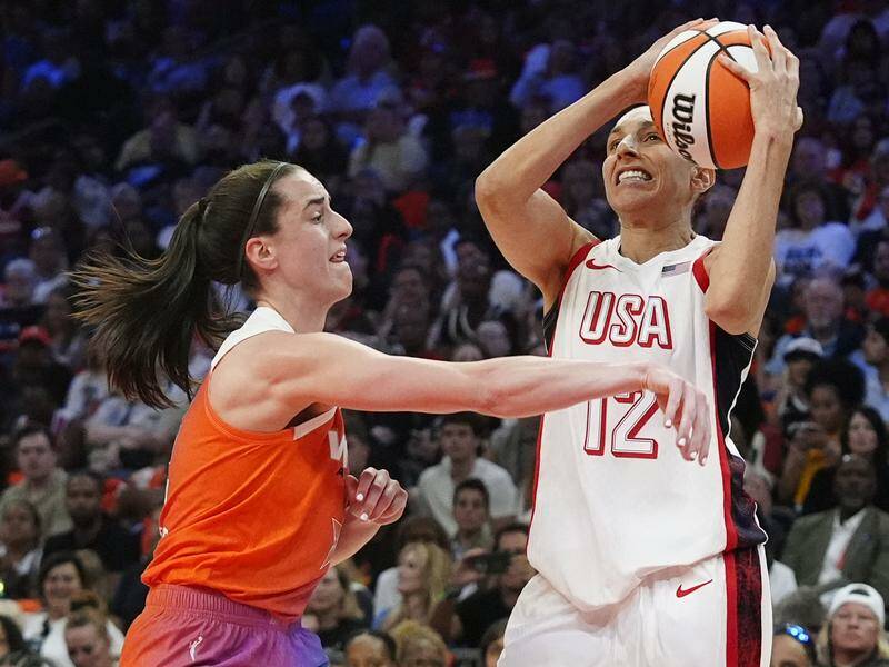 Caitlin Clark (L) enjoyed her first WNBA All-Star match, helping down Diana Taurasi's (R) Olympians. Photo: AP PHOTO