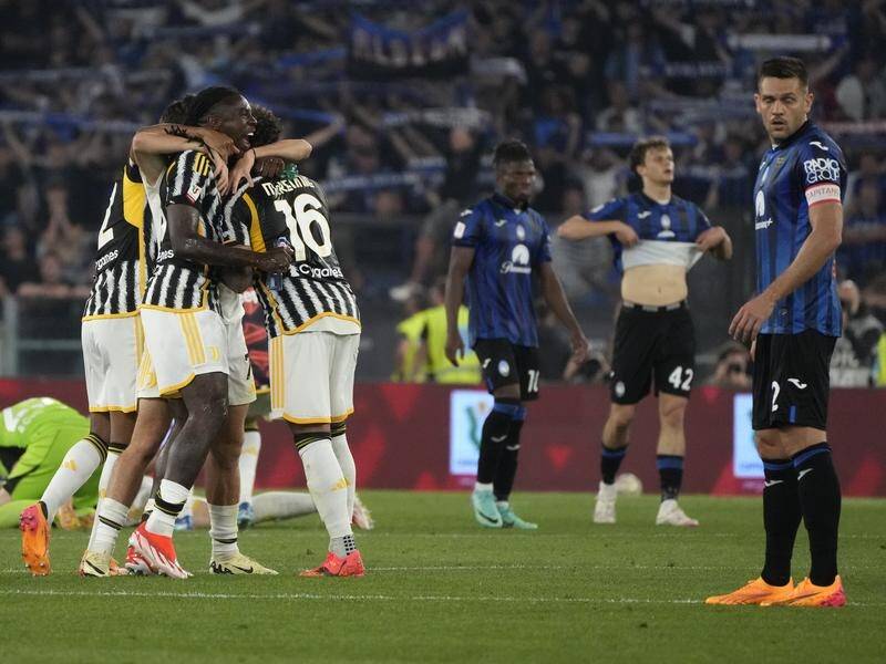 Juventus players celebrate their Italian Cup final success over Atalanta in Rome. (AP PHOTO)