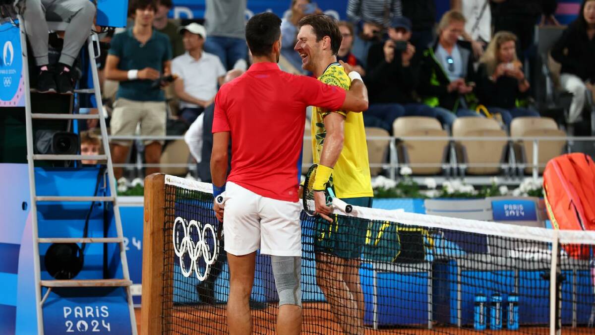 Djokovic and Ebden shared a joke at the end of their 53-minute contest. (EPA PHOTO)