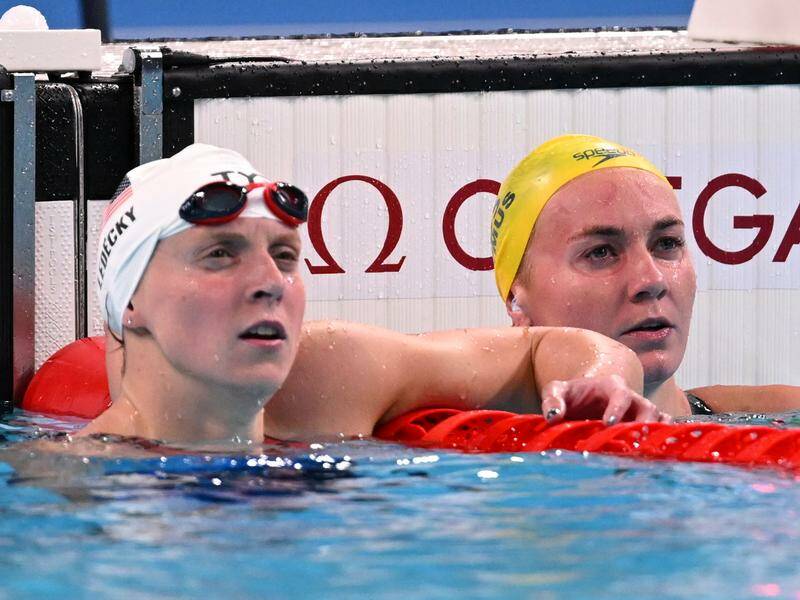 Katie Ledecky and Ariarne Titmus after their women's 400m freestyle heat in Paris. Photo: Dave Hunt/AAP PHOTOS