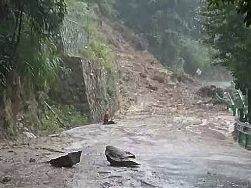 Rain brought by a tropical storm has caused a mudslide in a Chinese village, killing 15 people. Photo: AP PHOTO