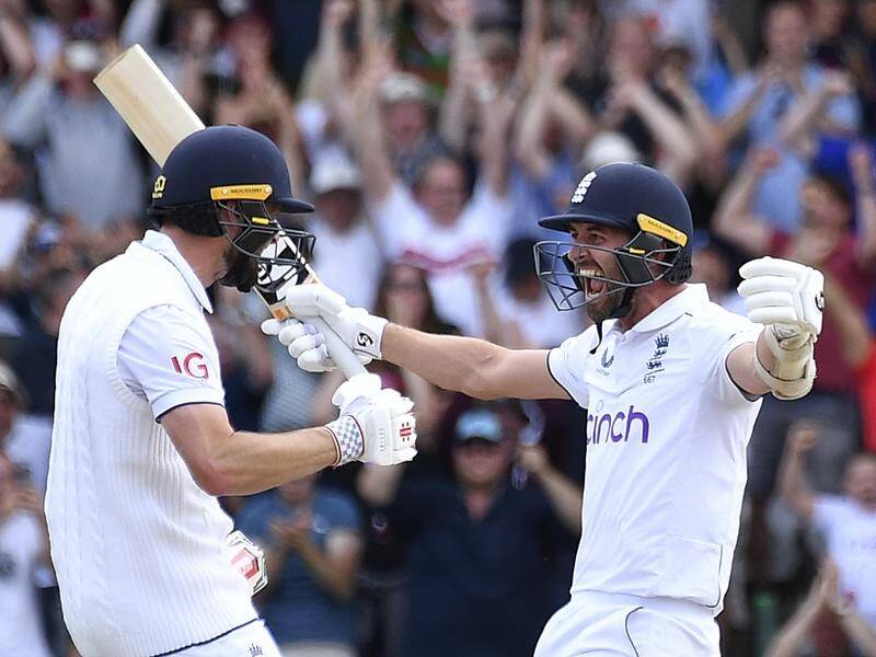 Chris Woakes and Mark Wood celebrate England's triumph in the Headingley Ashes Test match. (AP PHOTO)