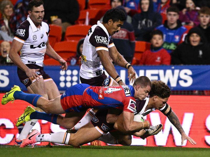 Broncos' Reece Walsh scores a try against the Knights to crown his best display since May. Photo: Dan Himbrechts/AAP PHOTOS