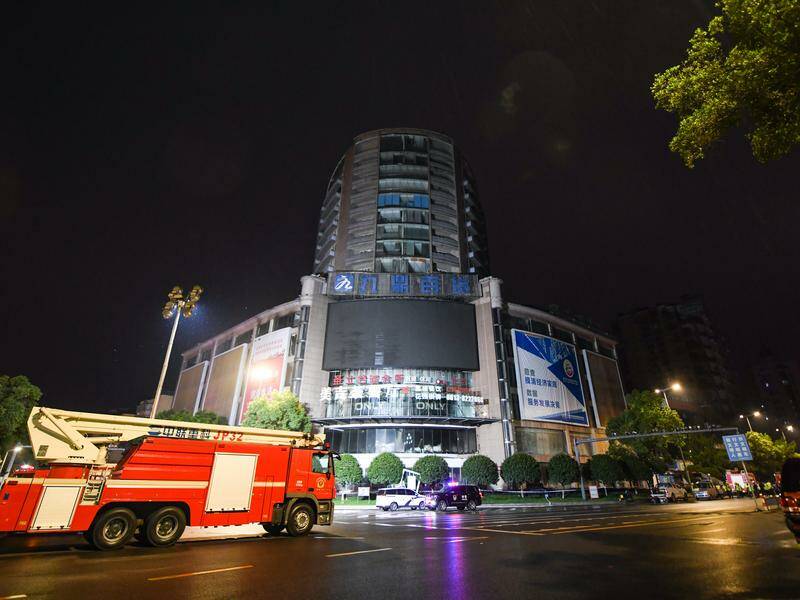 The 14-storey commercial building was evacuated and 75 people were led to safety, state media said. Photo: EPA PHOTO
