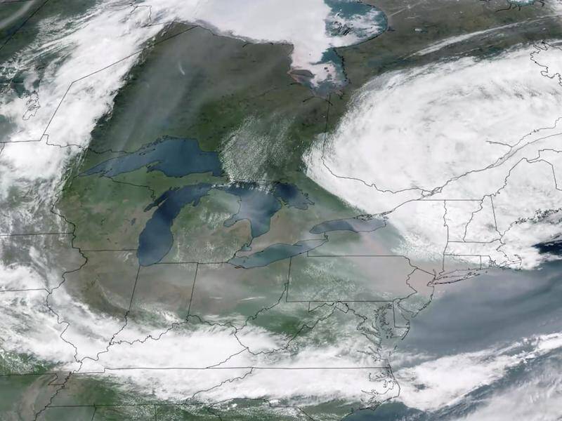 Forest fires in Canada have sent a smoky haze billowing over a large swath of the United States. (AP PHOTO)