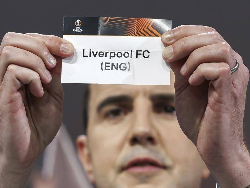 John O'Shea draws the name of Liverpool in the Europa League last-16 draw at UEFA HQ in Nyon. (AP PHOTO)