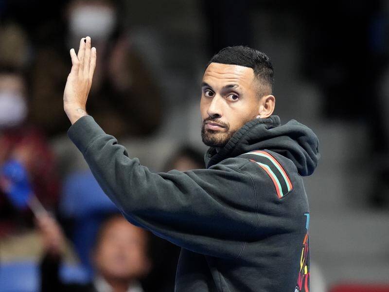 Nick Kyrgios waves farewell to the Tokyo crowd after his pre-match withdrawal against Taylor Fritz. (AP PHOTO)