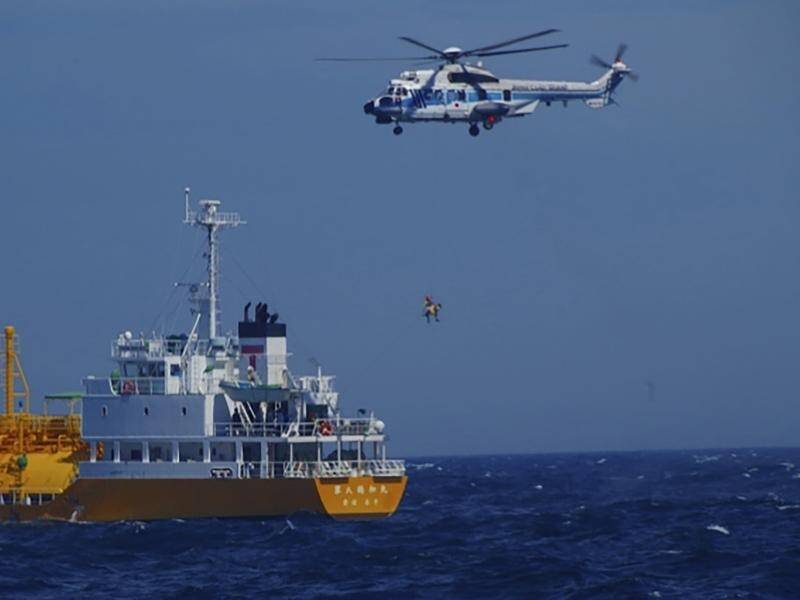 Japan's coast guard airlifted the swimmer to safety after she was sighted by a passing cargo ship. (AP PHOTO)
