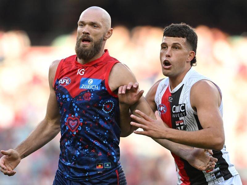 Melbourne's Max Gawn (left) overcame an injury scare to outpoint St Kilda's Rowan Marshall (right). (James Ross/AAP PHOTOS)