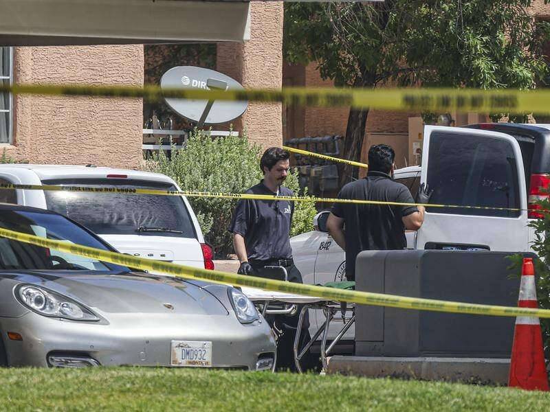 Police investigate the scene of a shooting at an apartment complex in North Las Vegas. (AP PHOTO)