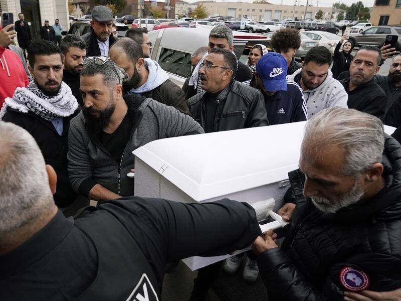 Family members of Wadea Al Fayoume bring his casket into the Mosque Foundation in Illinois. (AP PHOTO)
