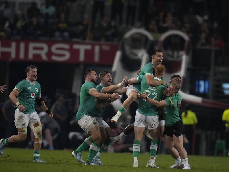 Ireland's players celebrate after beating South Africa at the last gasp in Durban. (AP PHOTO)