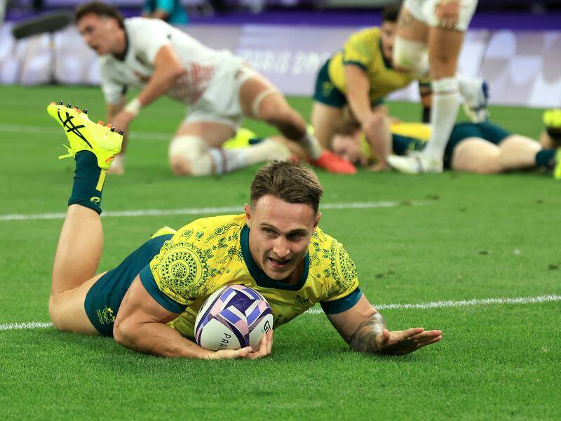 Corey Toole scores a try in Australia's 18-0 quarter-final win over the United States. Photo: Iain McGregor/AAP PHOTOS