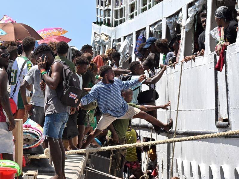 Honiara residents are boarding overcrowded vessels to return to their home towns to vote. (Mick Tsikas/AAP PHOTOS)