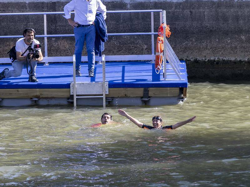 Paris Mayor Anne Hidalgo swims in the Seine to prove its clean, but results now show it wasn't. Photo: EPA PHOTO
