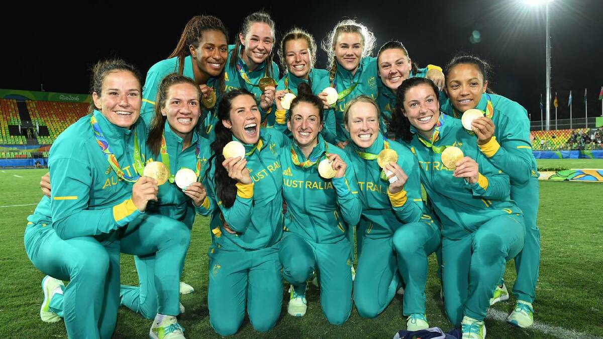 Australia's squad celebrate their gold medal triumph at the Rio Olympics in 2016. (Dean Lewins/AAP PHOTOS)